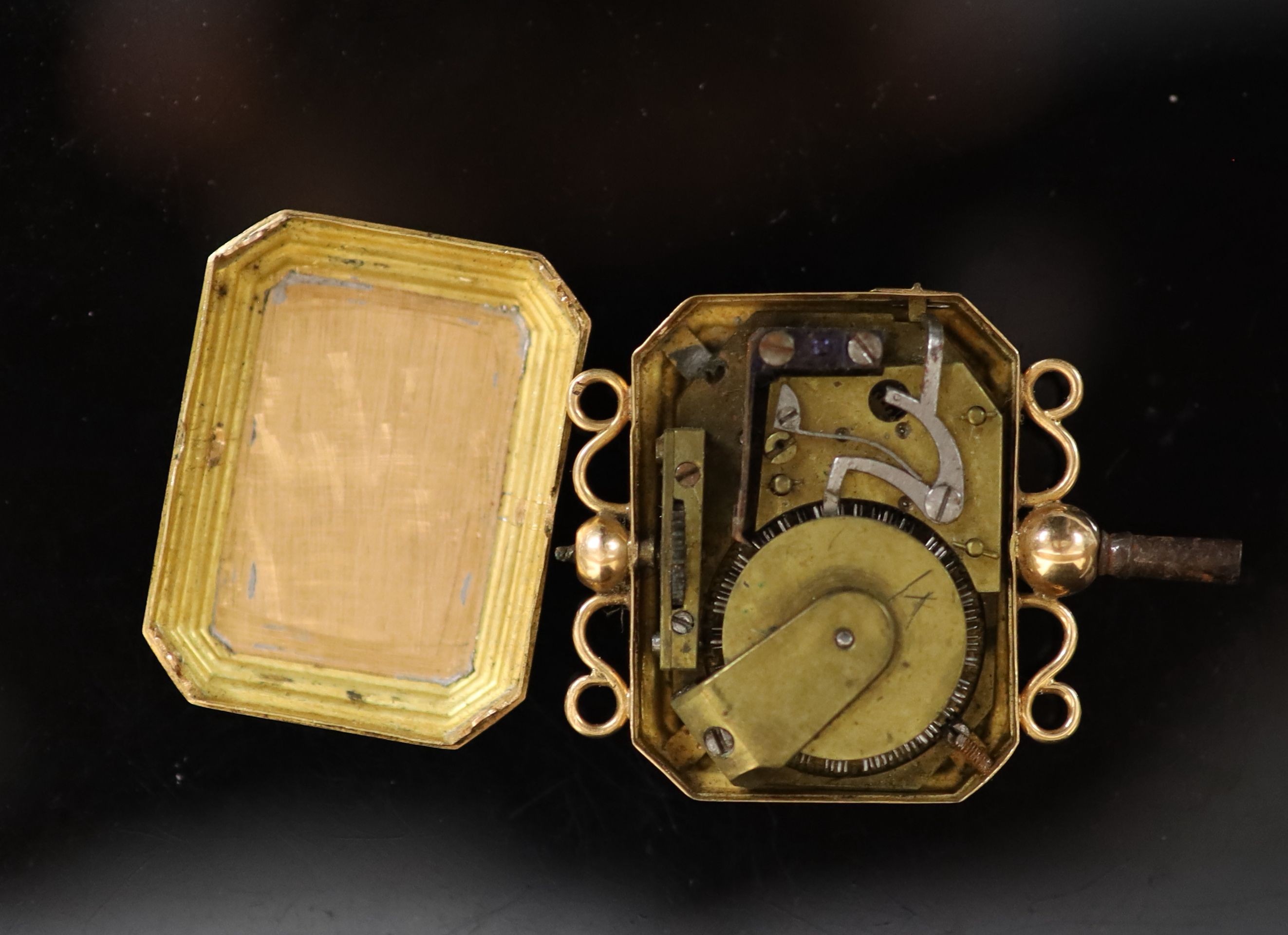 A 19th century three colour gold cased musical watch key